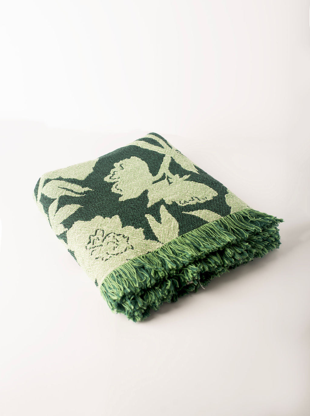 Folded Addy Spruce green floral reversible jacquard woven throw blanket