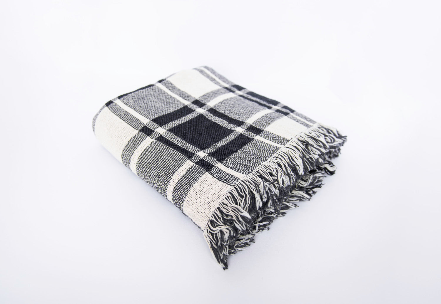 Folded Ellis black-and-white plaid reversible jacquard woven throw blanket