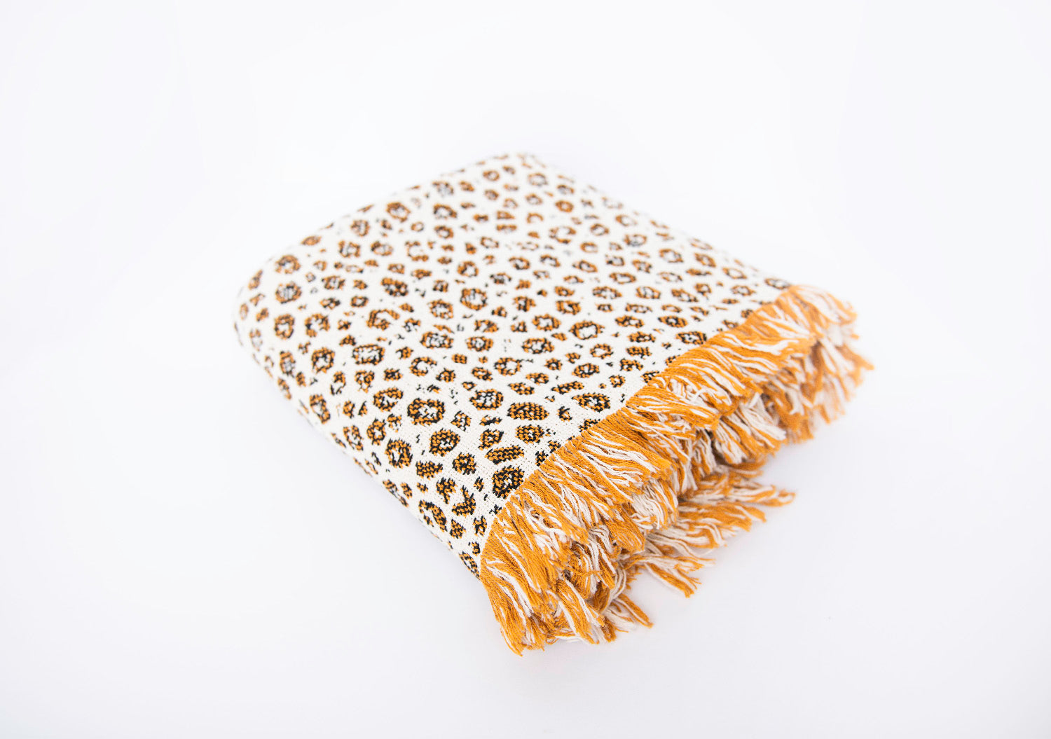 Folded Zola golden leopard-print reversible jacquard woven throw blanket